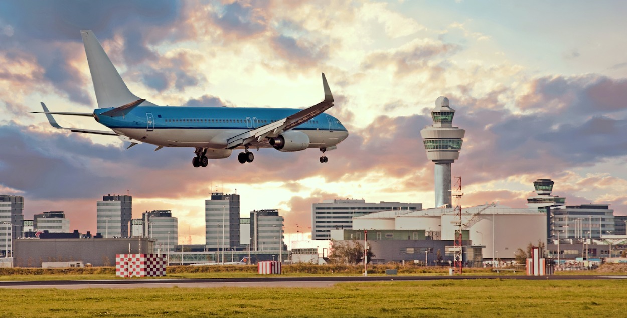 Picture of a KLM airplane landing at Schiphol. 